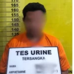 Tersangka penganiayaan diamankan di Mapolsek Pujud usai menyerahkan diri, Jumat (20/2/2026).