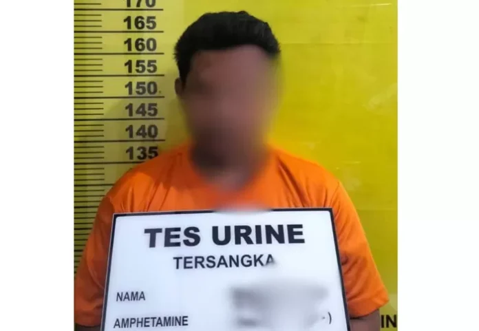Tersangka penganiayaan diamankan di Mapolsek Pujud usai menyerahkan diri, Jumat (20/2/2026).